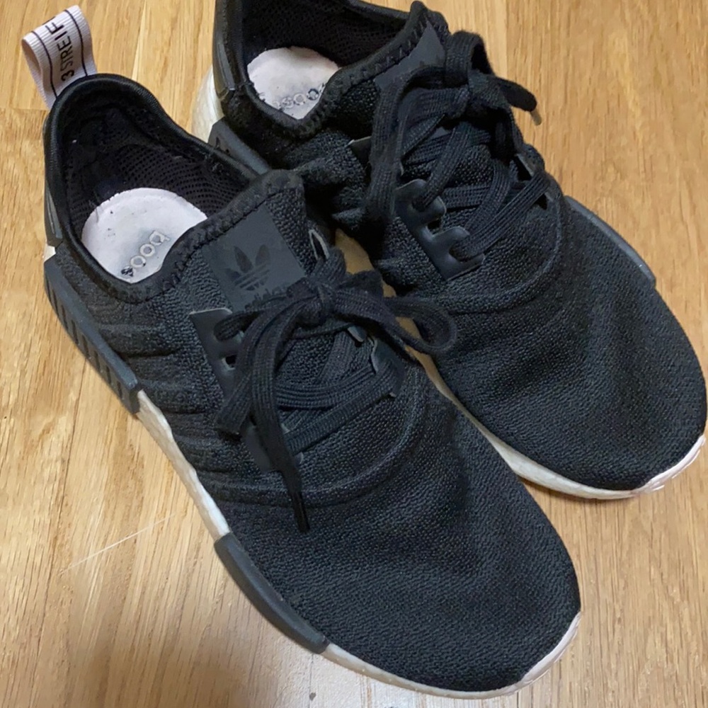 Adidas NMD_R1 tennis shoes.
